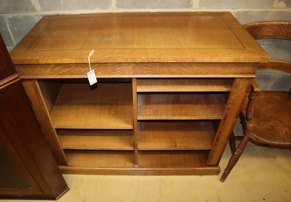 A modern light oak open bookcase, with adjustable shelves, W.110cm, D.52cm, H.90cm